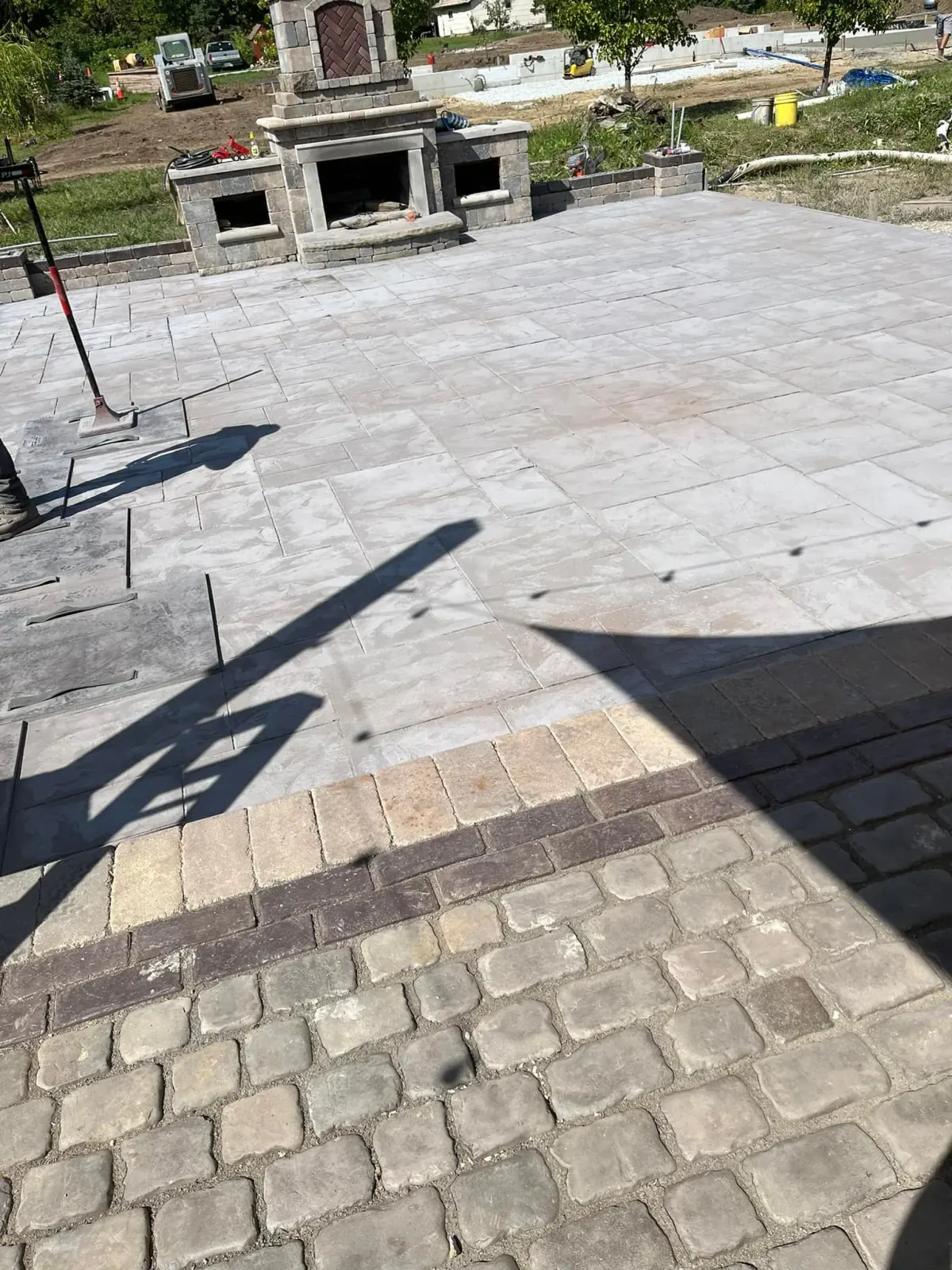 Backyard paver patio with outdoor chimney